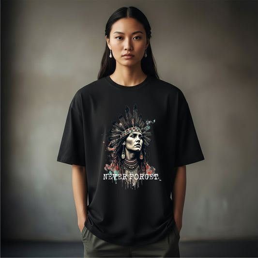 “Black oversized t-shirt featuring a stylized portrait of a Native person in traditional feathered headdress with the text ‘NEVER FORGET.’ Part of the First Nations Edition by History Threads.”